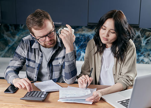 Couple Reviewing and Managing Their Bills Together